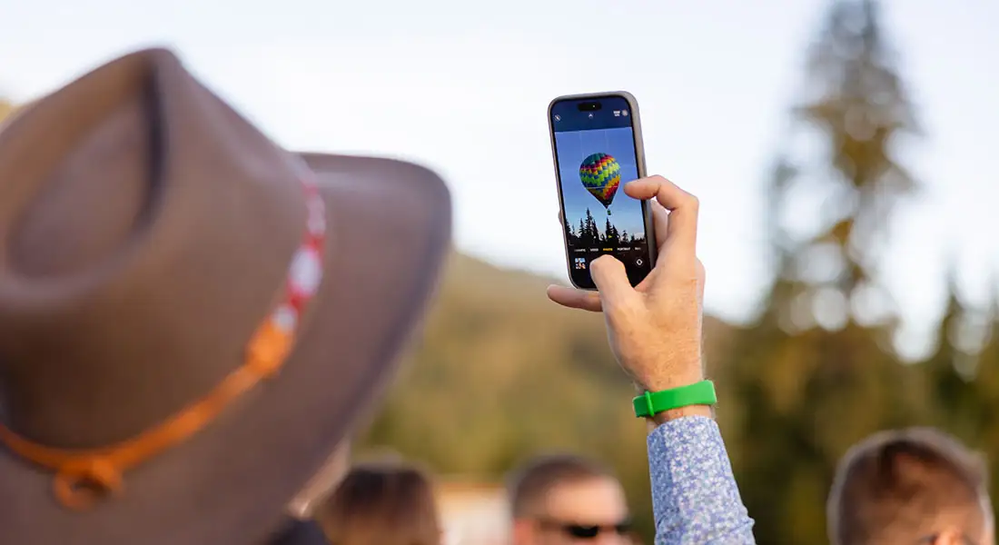 incentive trip attendee filming balloon ride